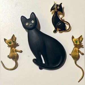 Four Vintage cat pins/brooches.